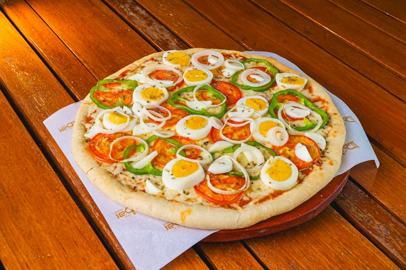 Close-up of Detroit-style pizza with caramelized cheese crust edge