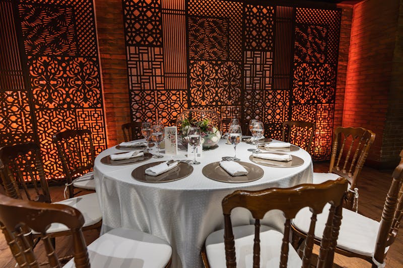 Elegant private dining event setup at Via 313 with guests enjoying pizza